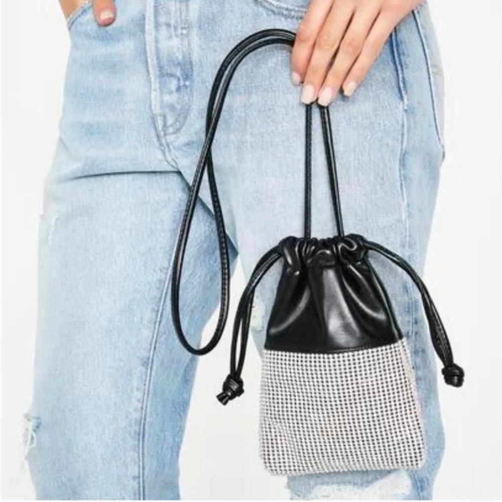 Poster Girl Check the price tag blinged bag